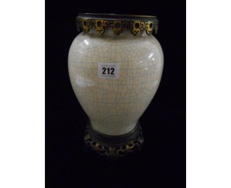 A Chinese oil lamp base with crackle decoration, on gilded base