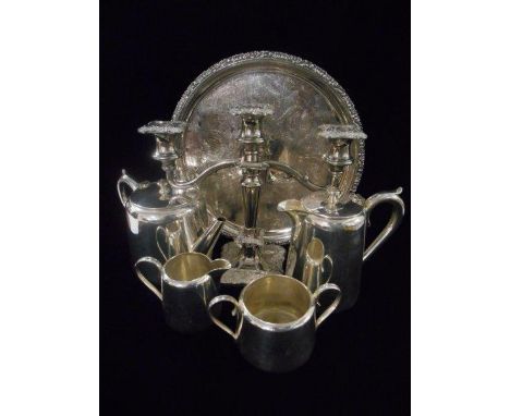 A hotel plate four piece tea and coffee service, a silver plated twin branch candelabra and a blue and white prunus pattern g