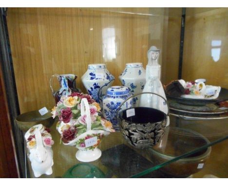 A selection of decorative china including a Poole Pottery Millennium plate, a pair of Delft vases and tea caddy, a selection 