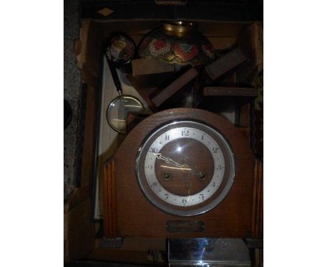 A 1930's Smiths mantel clock in an oak case, a pair of bookends in the form of books, a selection of magnifying glasses, a br