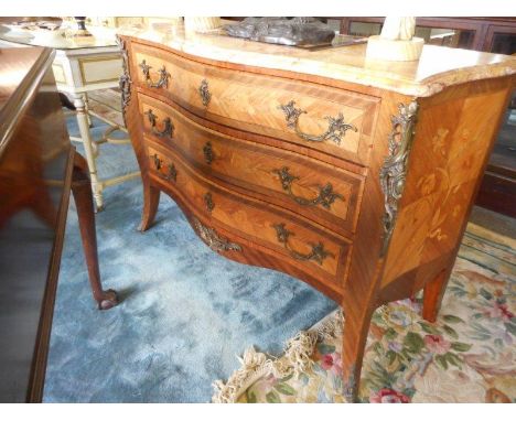 A French walnut and floral marquetry inlaid commode with pink marble top, fitted three drawers, on slender legs with gilt met