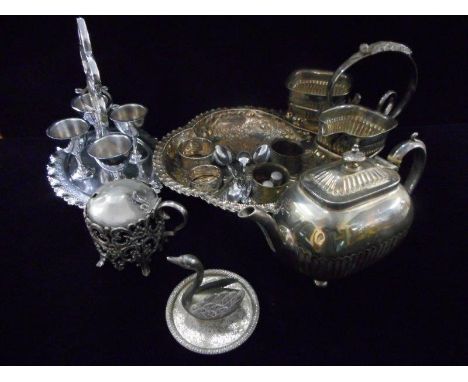 A selection of silver plate including two silver napkin rings, silver thimble, four cup eggerie, presentation strawberry dish