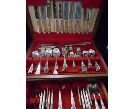 A mahogany canteen of silver plated flatware