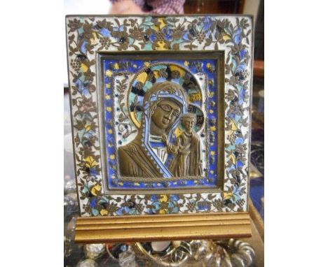 An enamel decorated icon depicting Madonna and child with floral decorated border