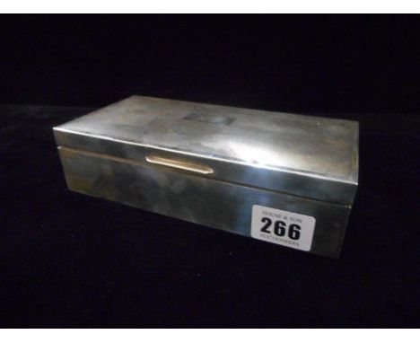 A large silver covered cigarette box with engine turned decoration - Birmingham 1924