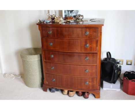 A MAHOGANY AND INLAID BOW FRONTED CHEST OF DRAWERS, with canted sides, with five long graduated drawers on bracket feet, 86cm