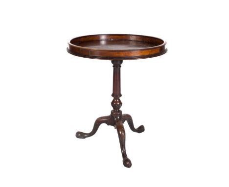 A GEORGIAN MAHOGANY CIRCULAR TILT TOP TABLE, with galleried rim (possibly added) on tapering baluster turned column support, 