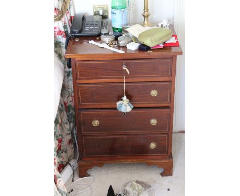 A PAIR OF MAHOGANY AND INLAID BEDSIDE CABINETS, formed as two chests of four long graduated drawers on bracket feet, 56cms wi