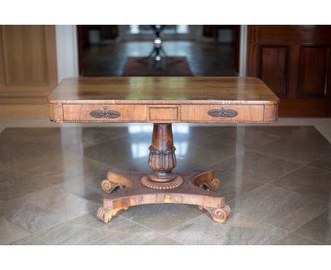 A MAHOGANY SOFA TABLE, c.1840, with two frieze drawers, on a carved tapering pillar support, concave platform base and scroll