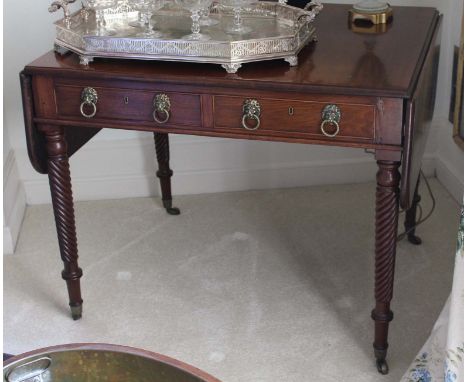 A MAHOGANY SOFA TABLE, EARLY 19th CENTURY, with a pair of frieze drawers to one side, dummy drawers to the other and lion rin