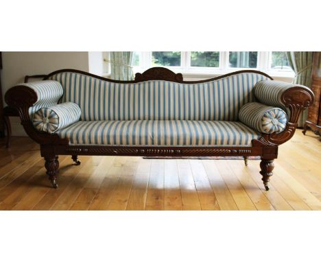 A MAHOGANY FRAMED GRECIAN STYLE SOFA, c.1840, with shaped padded back, the scrolling arms with bolsters, above a rope twist f