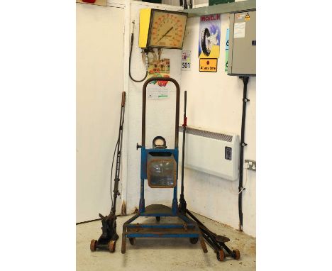 A Lucas 'Beamsetter', a Harvey Frost pre-war jack,another jack, anda Dunlop wall-mounted tyre inflator (4)