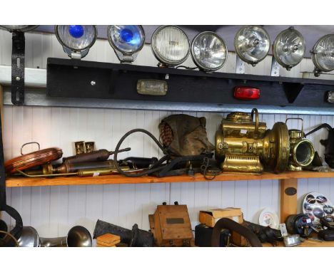 A Powell &amp; Hanmer acetylene self-generating brass headlamp,another smaller lamp,a brass-mounted lamp, andvarious veteran 