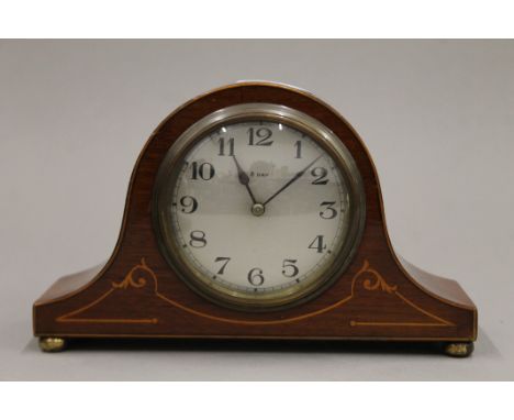 An Edwardian inlaid mahogany mantle clock. 21 cm wide.