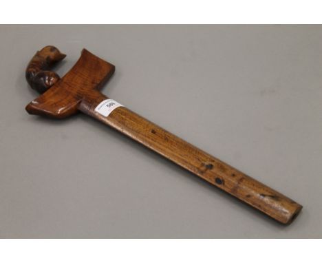 A Sumatran kris dagger with carved hardwood handle and sheath. 43 cm long.