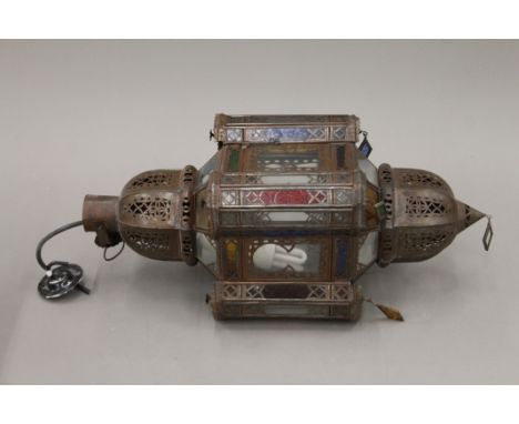 A Moroccan hanging light and a wall light. The former 53 cm high.