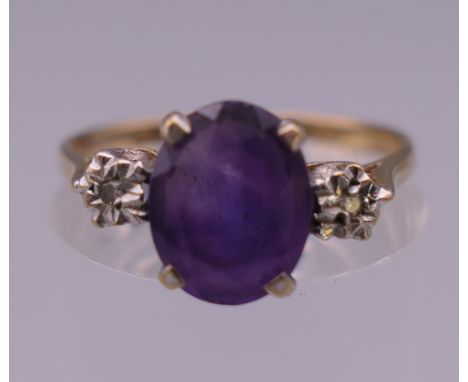 A 9 ct gold diamond and amethyst ring. Ring N/O. 1.7 grammes total weight.