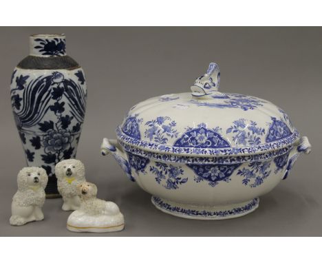 A quantity of porcelain, including three Staffordshire dogs, a Chinese blue and white porcelain vase, a blue and white porcel