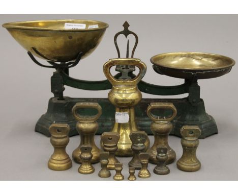 A set of vintage scales and weights. 37 cm long.