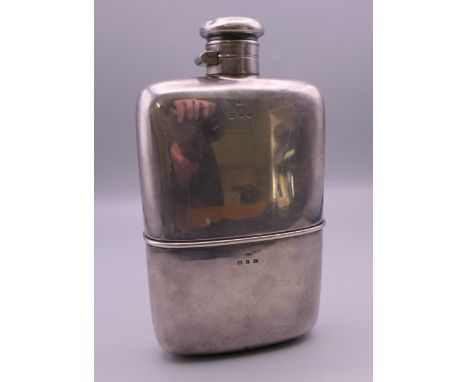 A silver spirit flask. 16 cm high. 308.2 grammes.