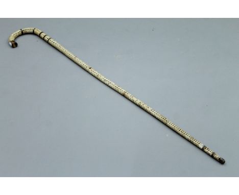 A shark vertebrae and horn walking stick. 90 cm high.