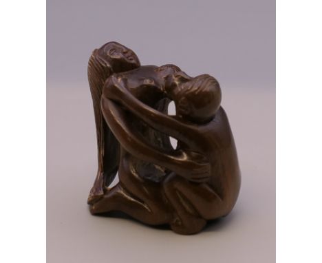 An erotic netsuke. 4.25 cm high.