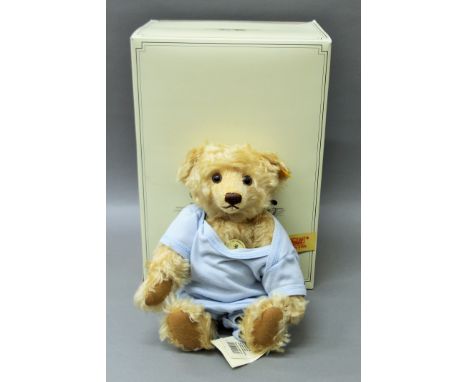 A Steiff boxed yellow tag classic teddy bear.