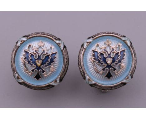 A pair of silver and blue enamel cufflinks. 1.5 cm diameter.