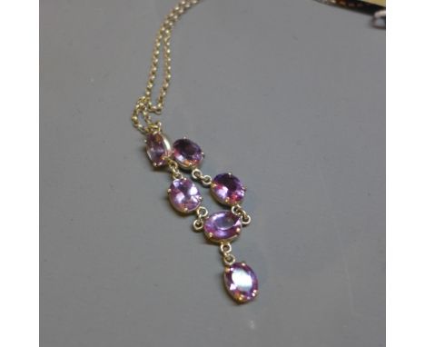 A silver and amethyst necklace