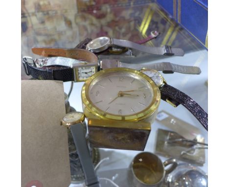 A collection of gents wristwatches to include a 9ct gold Rotary, together with an alarm clock