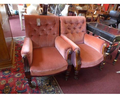 A pair of 19th Century mahogany framed armchairs upholstered in pink velour with button back, raised on carved, turned and fl