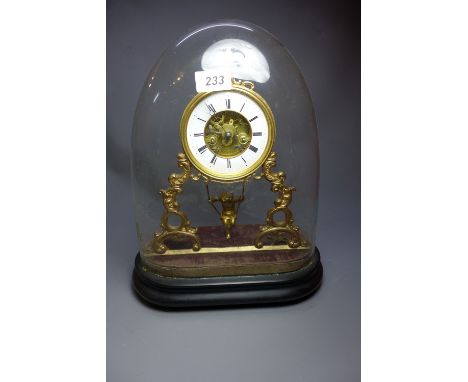 A C19th French gilt metal clock, having visible escapement, Roman numerals to the dial and a boy on a swing pendulum, contain