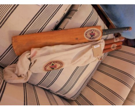 A vintage style cricket bat and stumps in original bag.