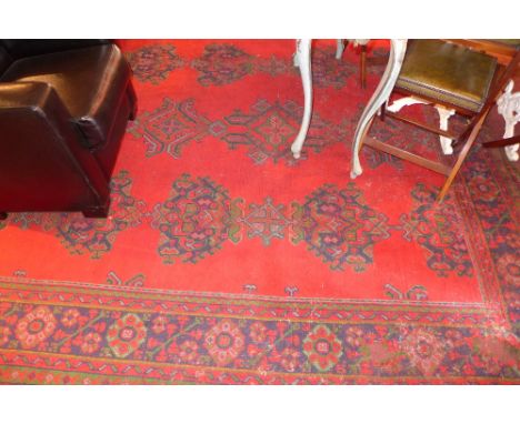 A vintage Ushak rug used for a number of decades at Abbey Road Studios, London, in the recording studios, having a red field 