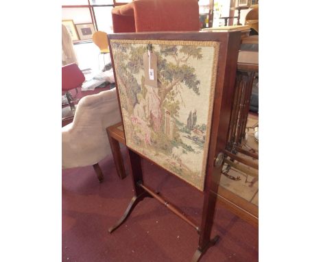 A 18th Century mahogany captain's desk, the fall front covered with a 19th Century tapestry, and enclosing writing surface wi