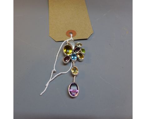A silver, blue topaz, amethyst, garnet and peridot pendant