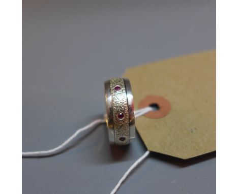 A hallmarked sliver and ruby ring with spinning mechanism