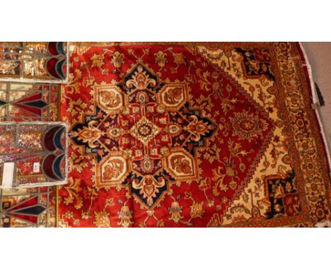 A contemporary carpet having a purple field 290cm x 200cm
