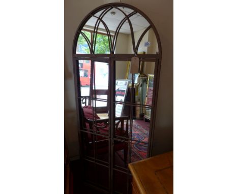 A cast iron framed garden mirror with arch top. H-180cm, W-75cm 