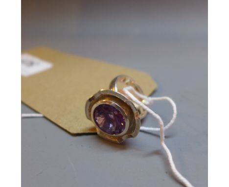 A sliver and laser cut amethyst ring