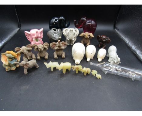 A collection of elephants in ceramic, glass, wood and onyx (one glass elephant has damaged trunk)