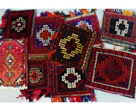 Collection of eight Belouch carpet bags, together with a small eastern mat, (9) 