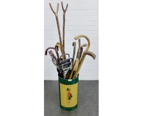 Stick stand with two shooting sticks and a collection of walking sticks, 128cm, (a lot) 