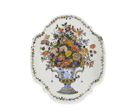 An oval Dutch Delft plaque, circa 1730-50Painted with several birds perched on a lush arrangement of flowers in a two-handled