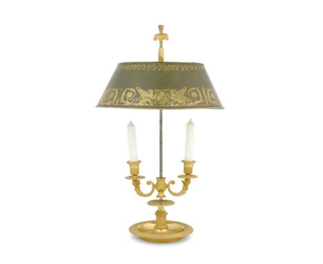 A French Empire ormolu two-light bouillotte lampEarly 19th centuryWith a green tôle peinte oval shaped shade decorated with g
