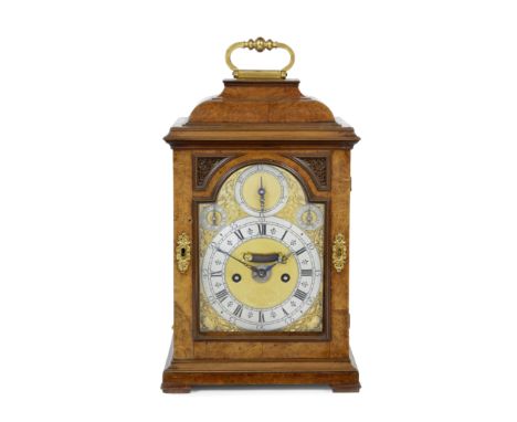 An early 18th century burr walnut table clock with alarmDaniel Quare, London, no.138The inverted bell top case surmounted by 