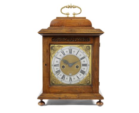 An early 18th century Dutch walnut repeating table clockJoan Klock, AmsterdamThe caddy top surmounted by a cast twin-bud hand
