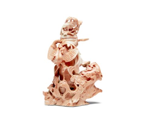 A carved coral 'Phoenix and Prunus' vaseMid-Qing DynastyThe vase naturalistically carved, emerging from a gnarled trunk with 