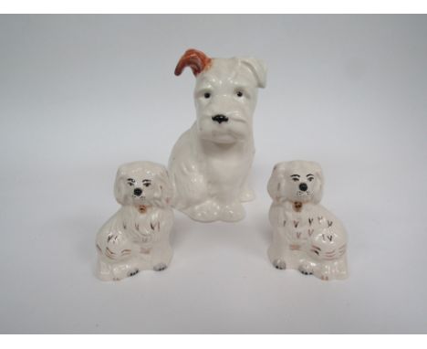 A Beswick Terrier Dog, model no. 398 together with  pair of Royal Doulton Old English mantelpiece dogs, model no's. 1378/7