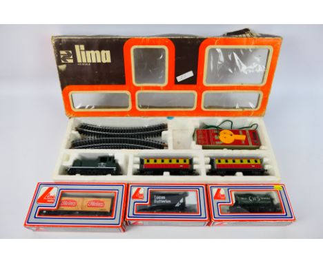 Lima - A boxed Lima HO gauge train set with three boxed items of OO gauge rolling stock Train set includes D2785 0-4-0 diesel